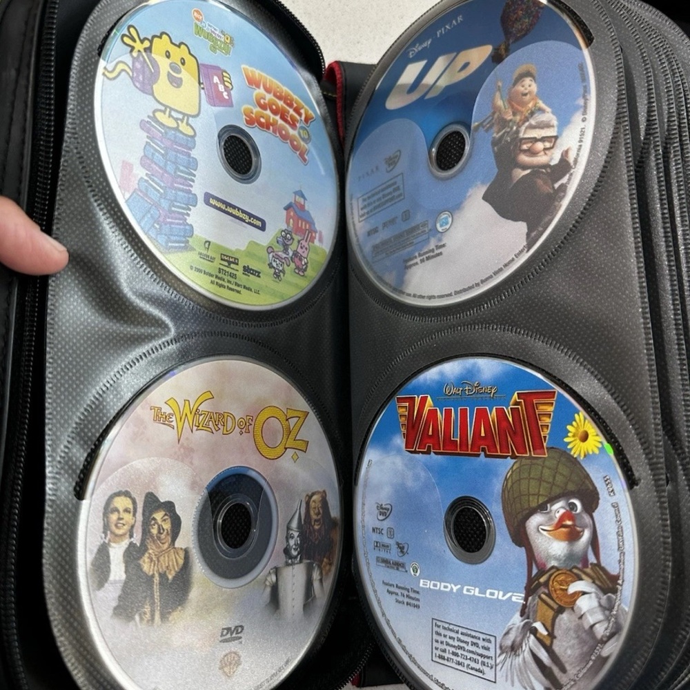 57 DVD Children’s Movies - Some of the titles can be seen in pics.